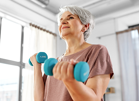 Woman lifting light weights