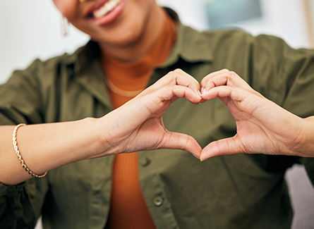 Woman making heart with hands