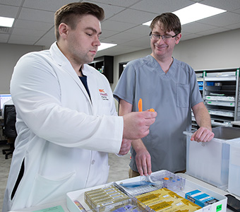 Two pharmacy workers 