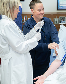 Pharmacist drawing syringe in ER