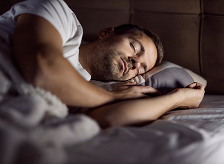 Man sleeping in bed